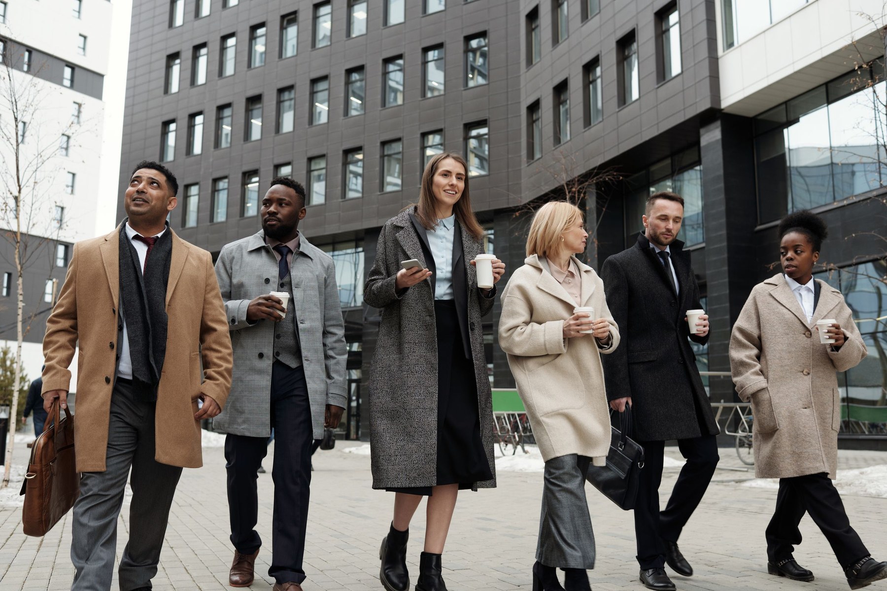Business professionals walking together outside an office